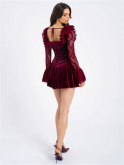  Women's velvet dress in red with a flared silhouette.