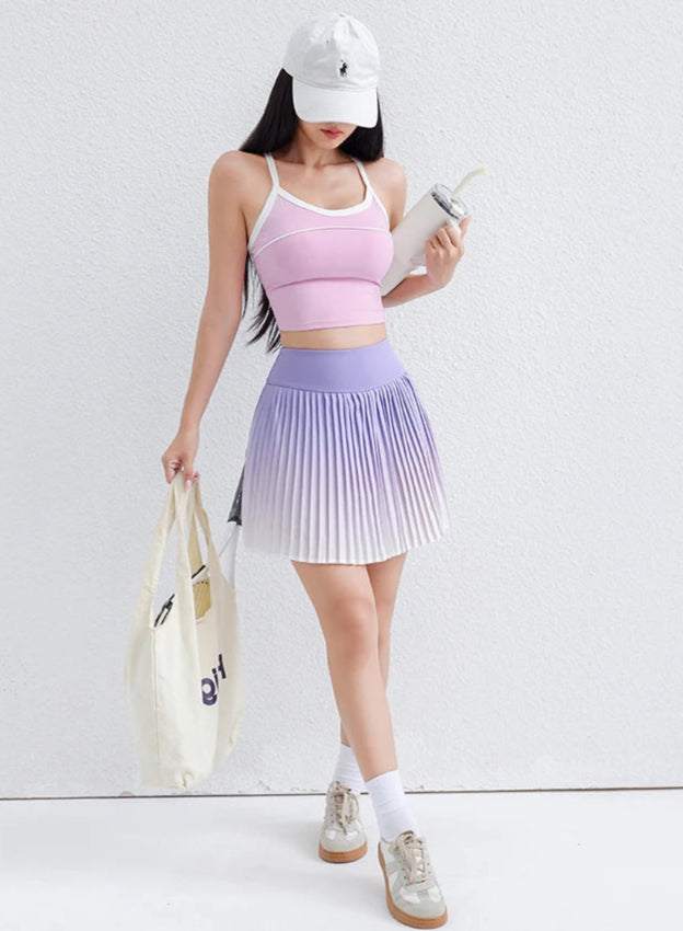 Woman in athletic wear holding a bag 