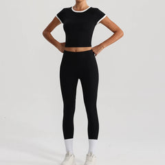 Person wearing a black athletic outfit full view