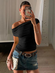 A one-shoulder crop top with a drawstring and ruched detailing.