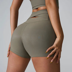 Person wearing olive green athletic shorts - side view