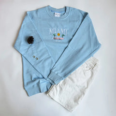  Women's Miami embroidered sweatshirt with an automobile graphic.