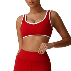 Red sports bra with white trim worn by a person front view