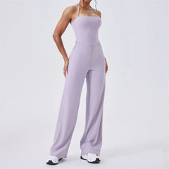 Person wearing a lavender jumpsuit on a white background
