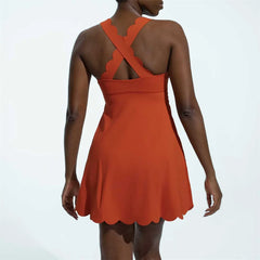 Orange dress with a scalloped back design - back view