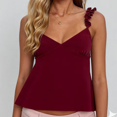 A burgundy top with ruffled straps