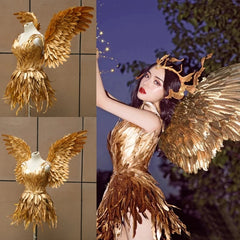Gold feathered costume with wings on a tiled wall and a person wearing it outdoors.