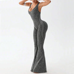 Woman wearing a gray leopard print jumpsuit - side view