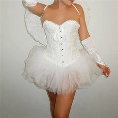 White angel costume with wings and a tutu on a plain background