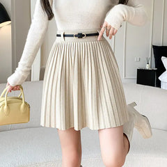 Women's pleated skirt with a belt and high waisted fit.