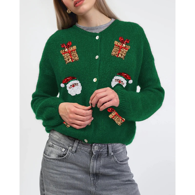 Green sweater with festive designs on a white background