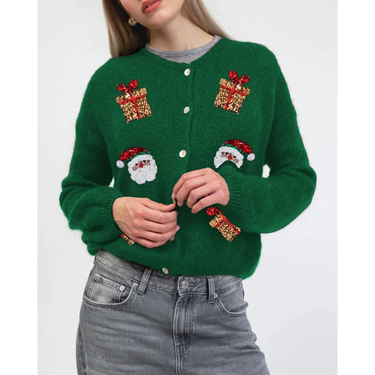 Green sweater with festive designs on a white background