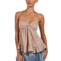 Woman wearing a checkered top with ruffle details on a white background
