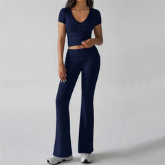 Person wearing a navy blue athletic outfit - full view