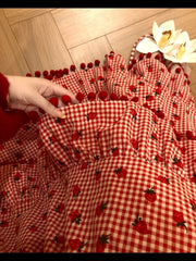 Women's red strawberry print tassel long skirt with tiered ruffles.

