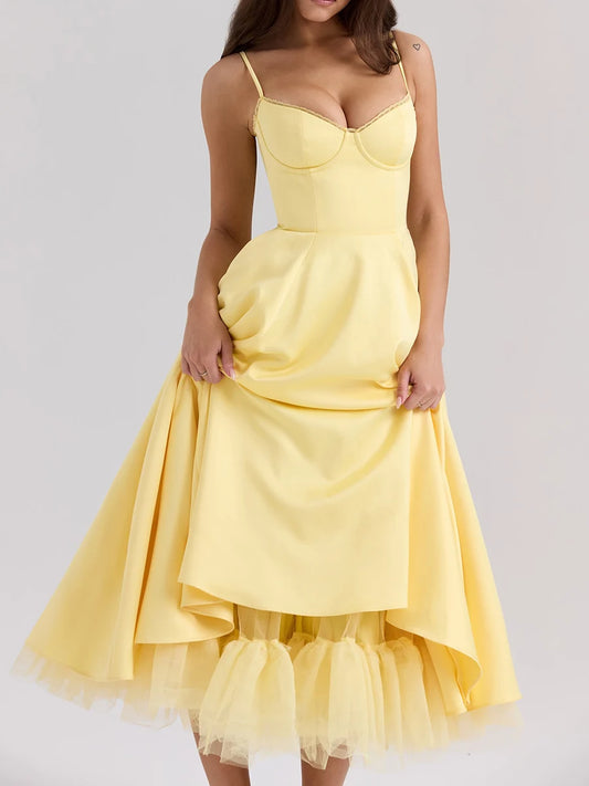 Yellow dress with a ruffled skirt on a white background