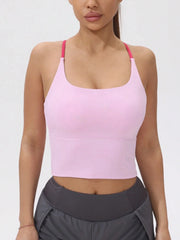 Person wearing a pink sports bra and gray leggings- front