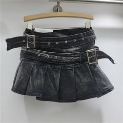 Black denim skirt with belt on a hanger against a white background