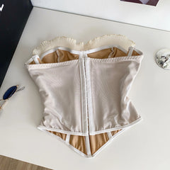 White waist trainer on a white surface with a blurred background