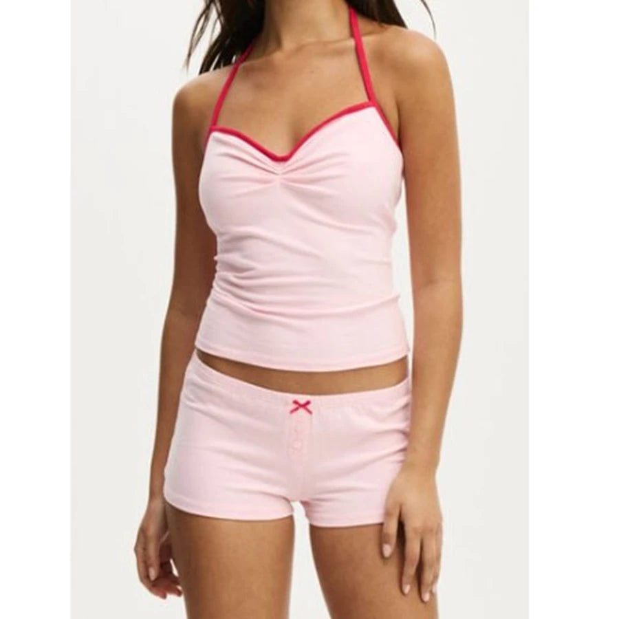Pink tank top and shorts set on a white background