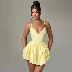  Women's mini dress with an open back design and layered ruffles.