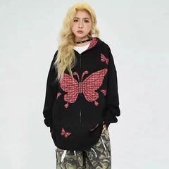Person wearing a black hoodie with red butterfly designs 