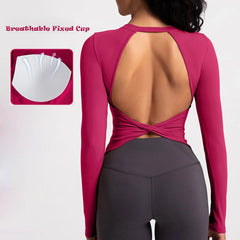 Pink long-sleeve top with open back and gray leggings- details