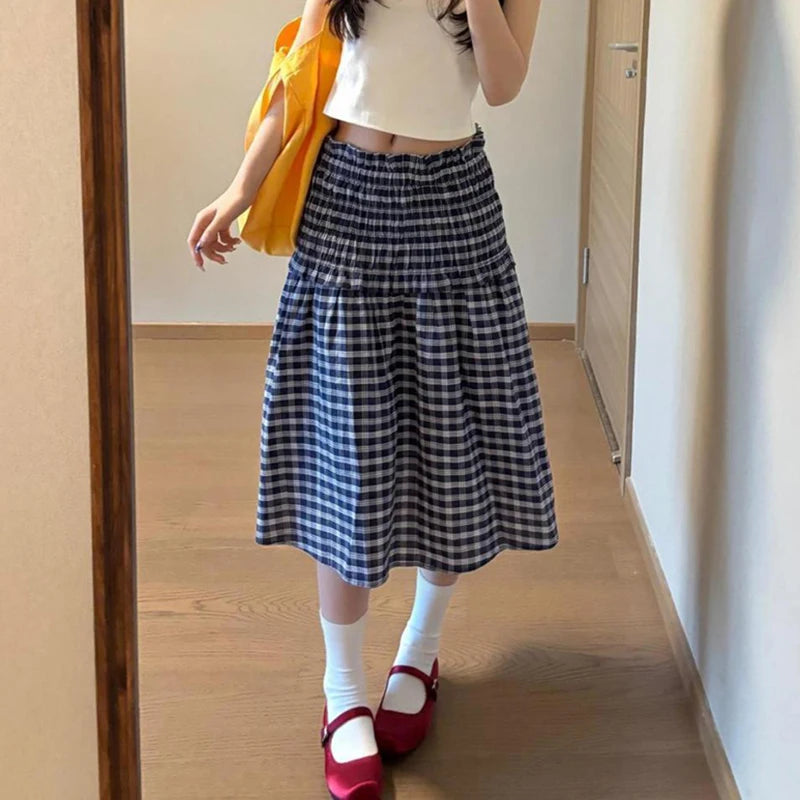 Women's blue elastic high waist plaid skirt with A-line silhouette.

