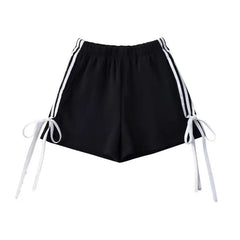 A pair of stylish shorts with a playful bow detail and a trendy striped print.