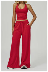 Woman wearing a red outfit with a top and wide-leg pants 
