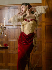 Woman in a gold and red outfit standing in a room with wooden paneling.
