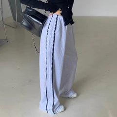 Women's  track pants with lace details.