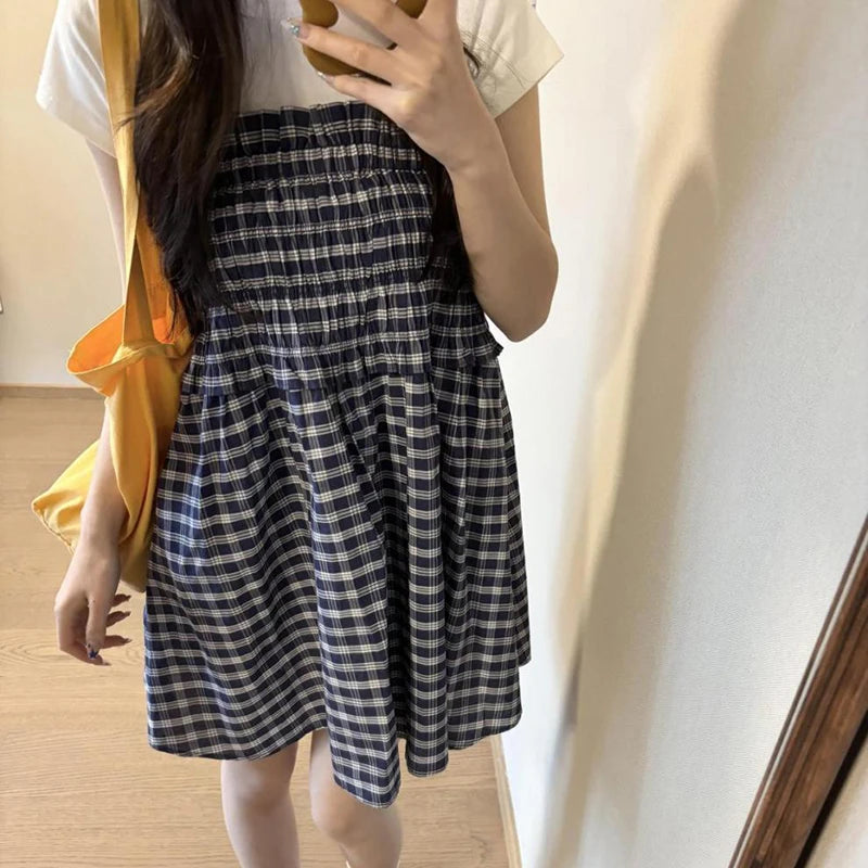 Women's blue elastic high waist plaid skirt with A-line silhouette.

