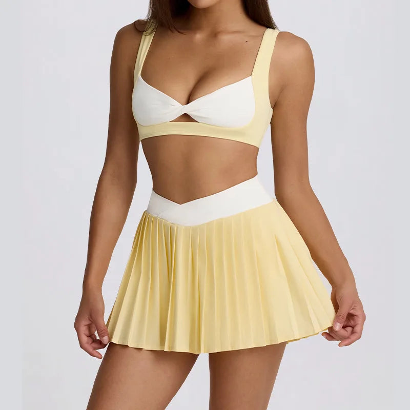 Woman wearing a yellow and white two-piece outfit 