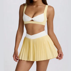 Woman wearing a yellow and white two-piece outfit 