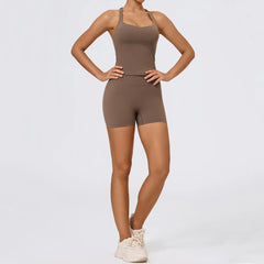 Person wearing a brown bodysuit on a light gray background