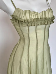 Green striped dress with ruffled neckline on a mannequin against a white background