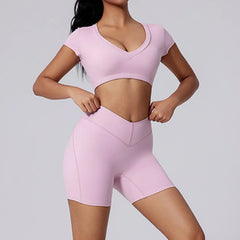 Person wearing a pink athletic outfit on a gray background