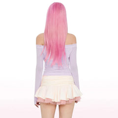 Person with pink hair wearing a light purple off-shoulder top and white skirt