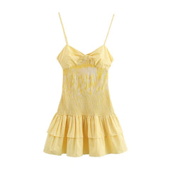Yellow checkered dress with thin straps on a white background