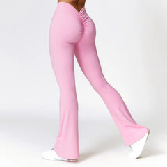 Pink flared pants worn by a person - side view