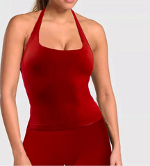 Red halter top worn by a person on a light gray background