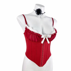 Red corset with white lace trim on a mannequin