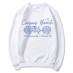 White sweatshirt with blue beach-themed design 