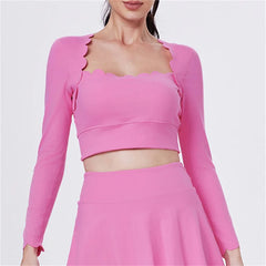 Pink long-sleeve top and skirt set on a white background