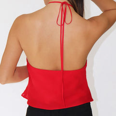 Red halter top worn by a person 