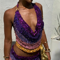 A colorful sequin top with a gradient of purple, pink, and gold 