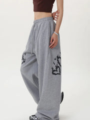 Gray sweatpants with black designs 