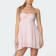 Women's pink bandeau scarf mini dress with floral print and A-line silhouette.

