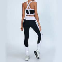 Person wearing a black and white athletic outfit - back view